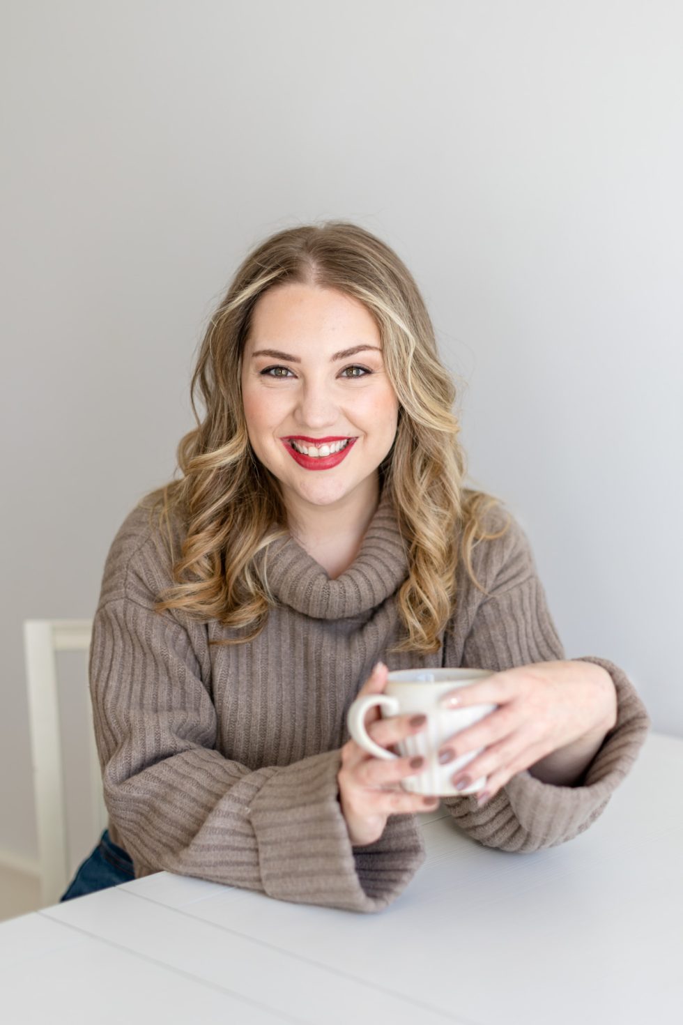personal brand photo of copywriter Megan Taylor holding a cup