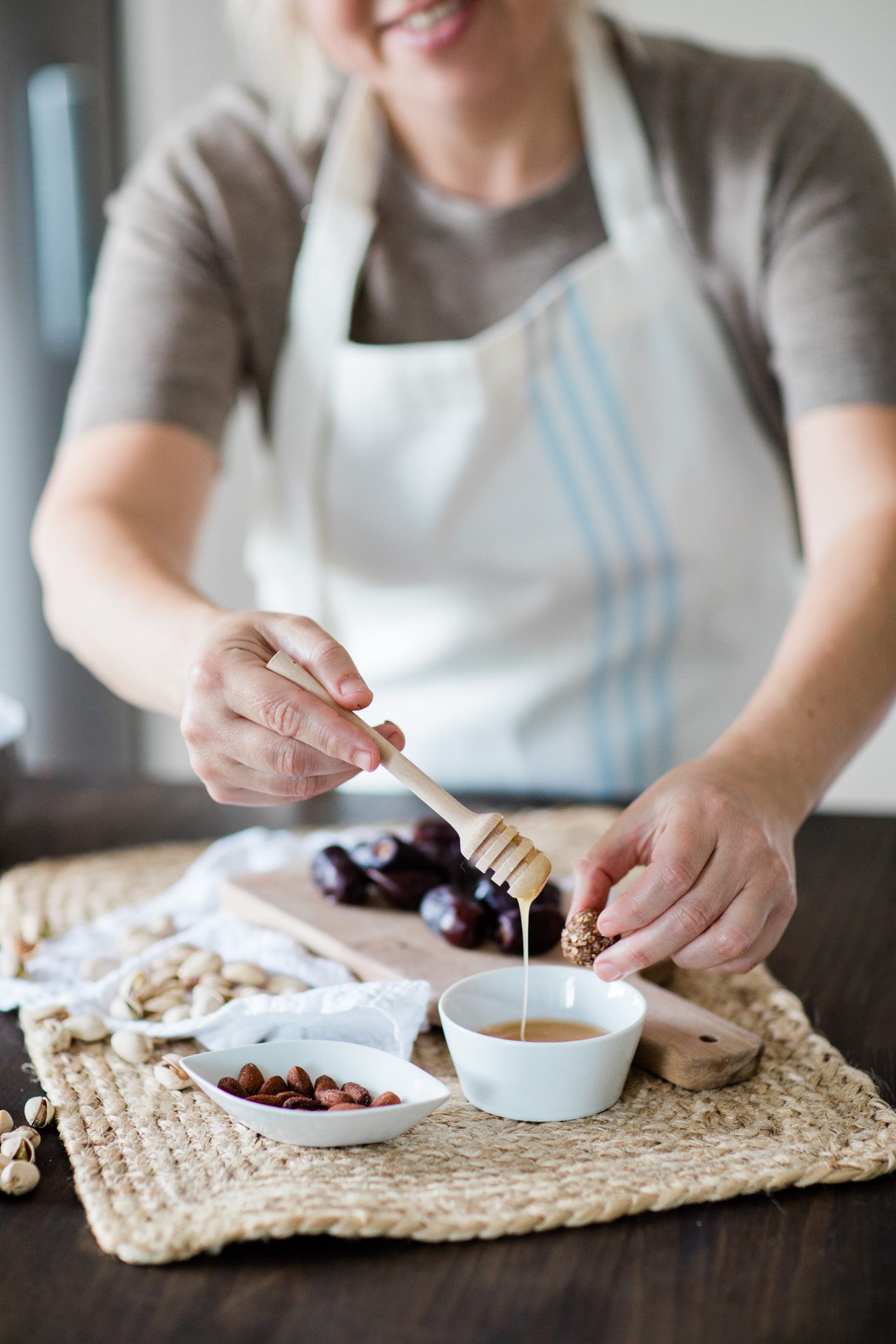 a personal brand photo of health coach Cecilia Isakson as she's making chocolate balls